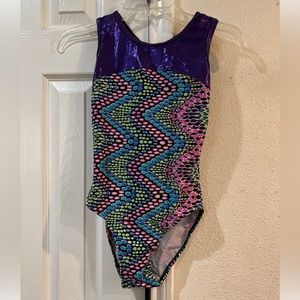 Womens Leo size adult medium. Purple shine with green/purple design contrast.
